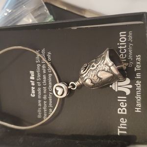 The bell collection bell with all papers and box.. This Does Not Include Chain.